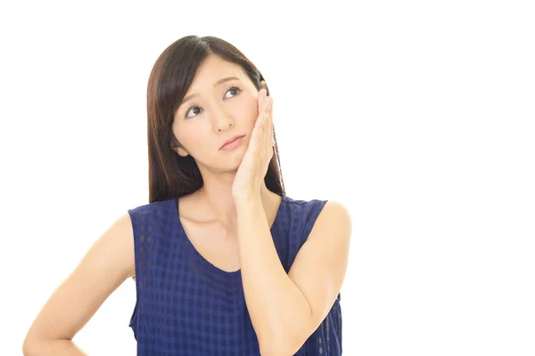 Uneasy Asian woman — Stock Photo, Image