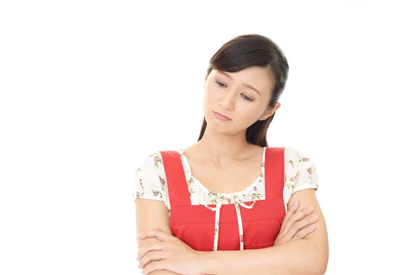 Disappointed Asian housewife — Stock Photo, Image