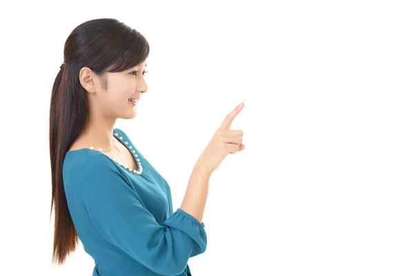 Woman pointing with her finger — Stock Photo, Image