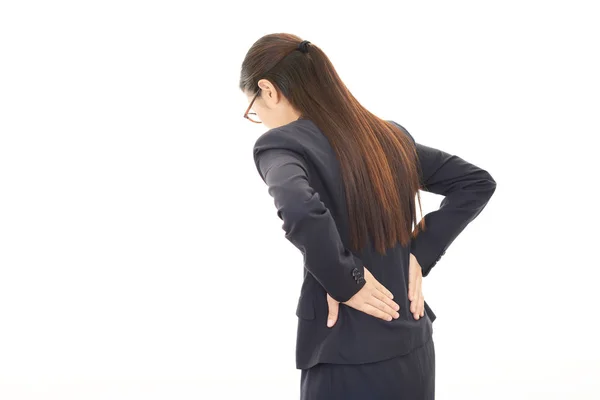 Mulher que tem dores nas costas — Fotografia de Stock