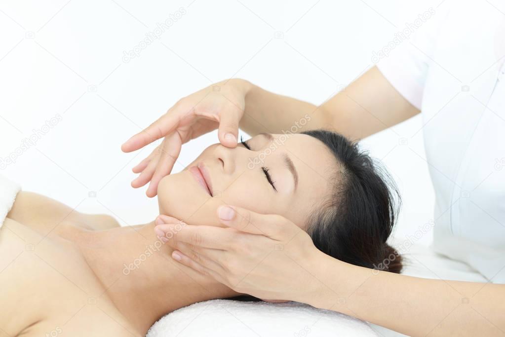 Woman getting a facial massage