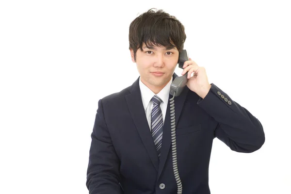 Affärsman med telefon — Stockfoto