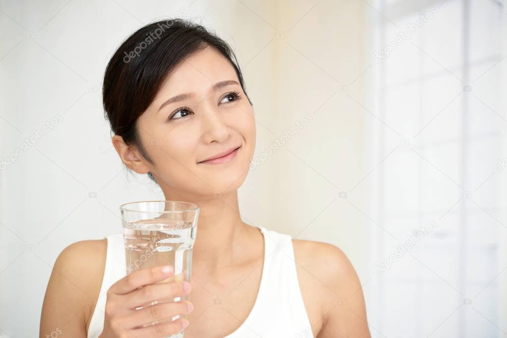 Woman drinking a glass of water