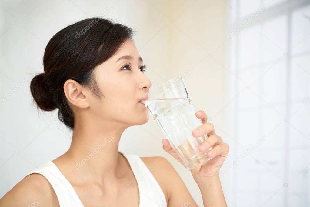 Woman drinking a glass of water