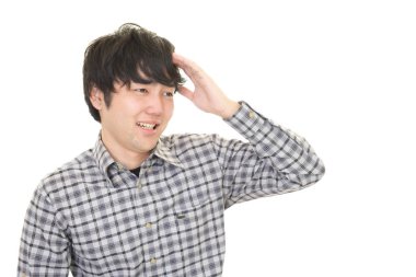 Hayal kırıklığına uğramış Asyalı adam