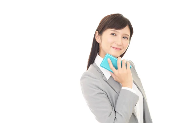 Affärskvinna med en smart telefon — Stockfoto
