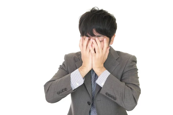 Disappointed Asian businessman Royalty Free Stock Photos