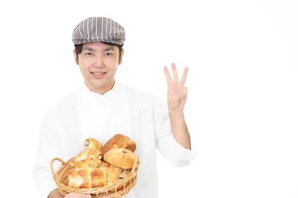 Sorridente panettiere asiatico — Foto Stock