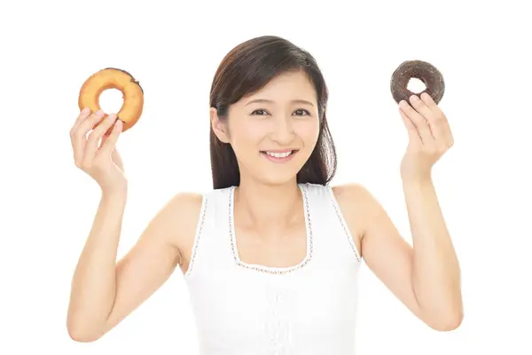 Woman eating sweets — Stock Photo, Image