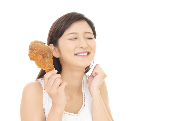 Mujer comiendo pollo —  Fotos de Stock