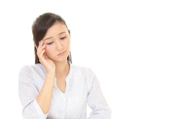 Mujer que tiene dolor de cabeza —  Fotos de Stock