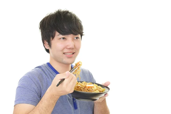 Человек, который ест еду — стоковое фото