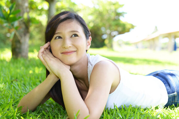 Young woman relaxing at the park