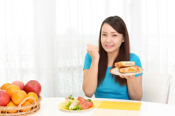 Woman having breakfast — Stock Photo, Image