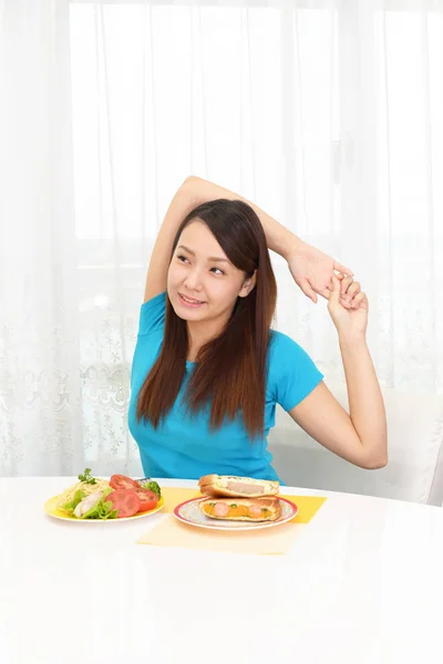 Woman having breakfast — Stock Photo, Image