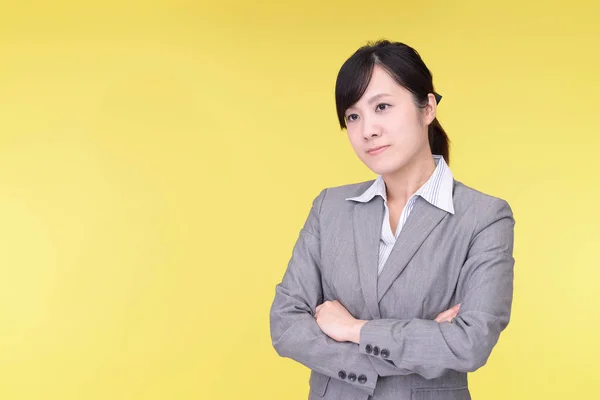 Uneasy Asian business woman — Stock Photo, Image