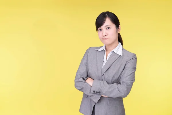 Uneasy Asian business woman — Stock Photo, Image