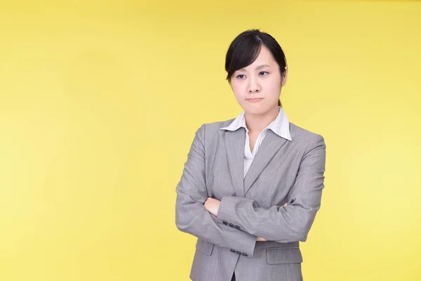 Uneasy Asian business woman — Stock Photo, Image