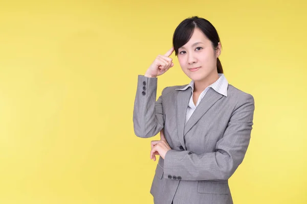 Uneasy Asian business woman — Stock Photo, Image