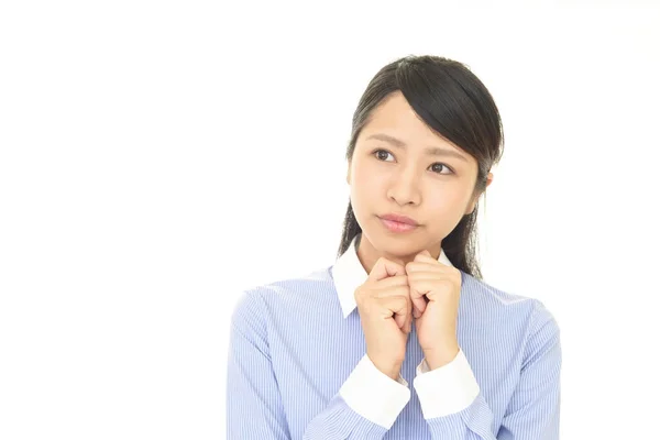 Uneasy Asian woman — Stock Photo, Image