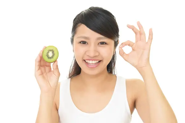 Woman holding fruit — Stock Photo, Image