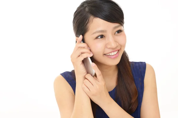 Mulher com um telefone inteligente — Fotografia de Stock