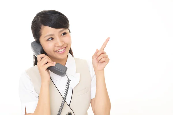 Mulher de negócios com um telefone — Fotografia de Stock