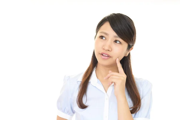 Uneasy Asian business woman — Stock Photo, Image