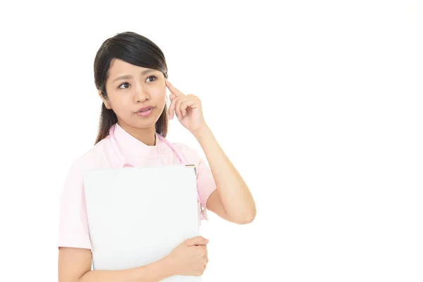 Worried Asian nurse. — Stock Photo, Image