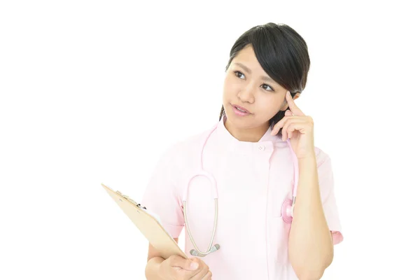 Besorgte asiatische Krankenschwester. — Stockfoto