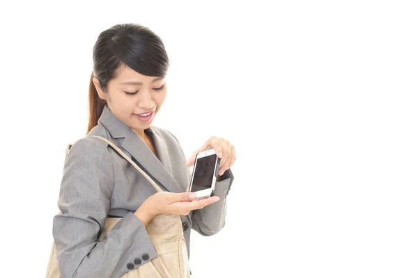 Business woman with a smart phone — Stock Photo, Image