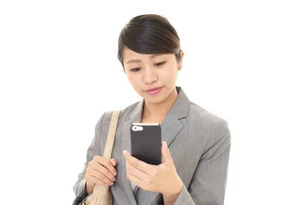 Business woman with a smart phone — Stock Photo, Image