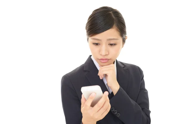 Uneasy Asian business woman — Stock Photo, Image