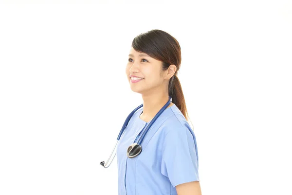 Sourire asiatique médecin — Photo