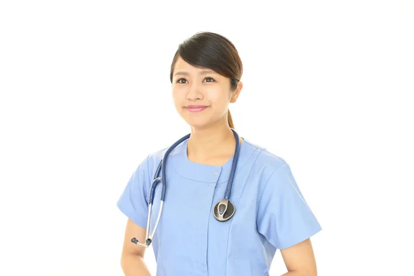 Sourire asiatique médecin — Photo