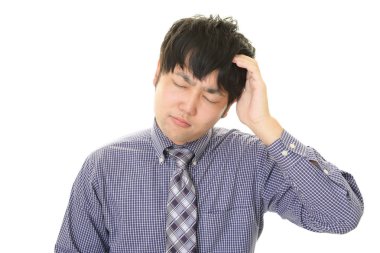 Huzursuz görünen bir iş adamı portresi