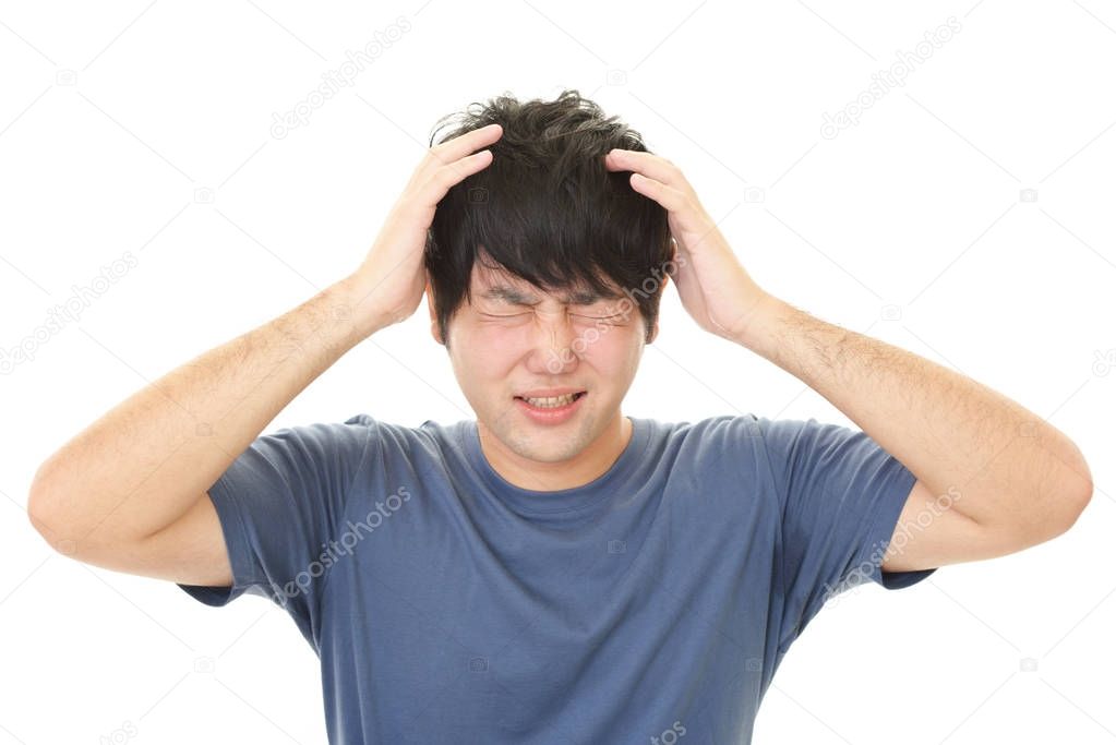 Frustrated Asian man isolated on white background