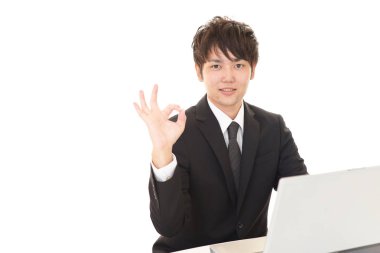 ok el işareti ile işadamı