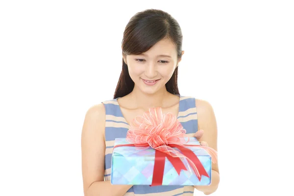 Stock image Smiling woman with a gift