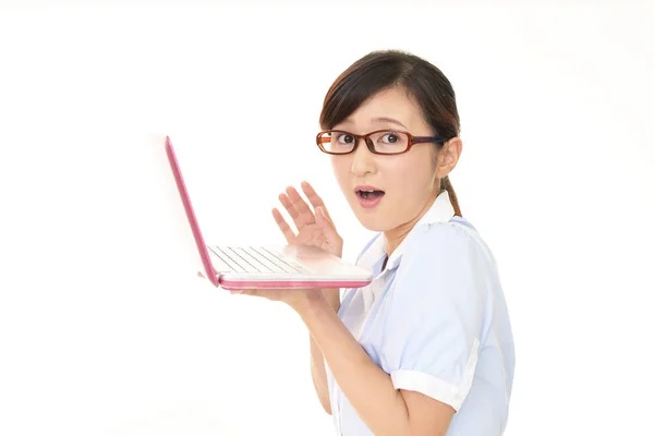 Surprised Female Office Worker Looking Laptop Royalty Free Stock Images