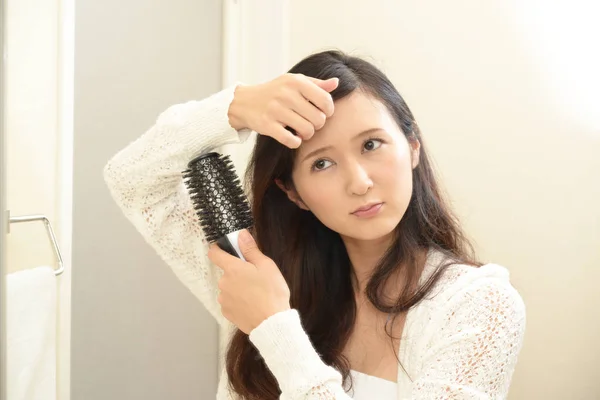 Woman brushing her hair