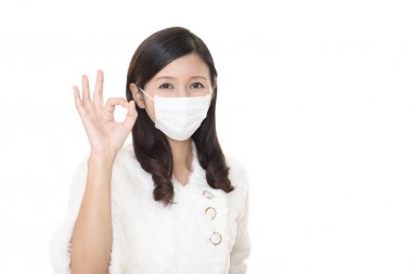 Young woman with protect mask on her face clipart