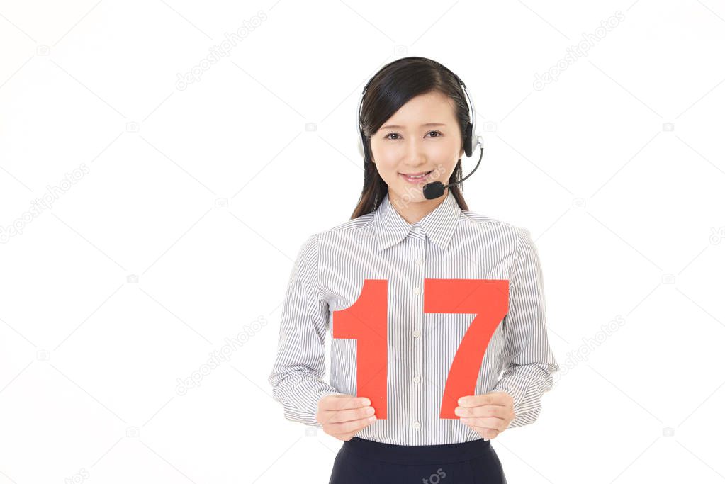Smiling call center operator with a number