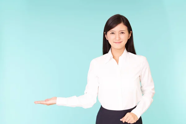 Woman showing something on the palm of her hand