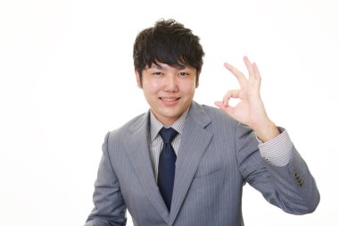 ok el işareti ile işadamı