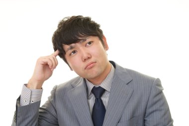 Huzursuz görünen bir iş adamı portresi