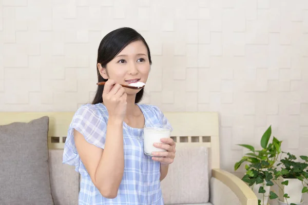 Woman who eats yogurt