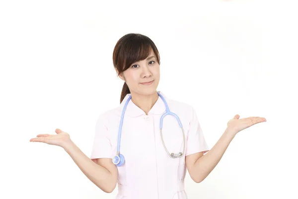 Krankenschwester Zeigt Etwas Auf Der Handfläche — Stockfoto
