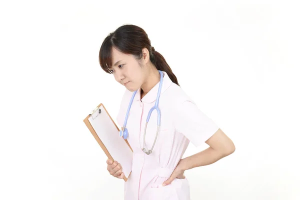 Asiatiska Kvinnliga Sjuksköterska Har Ett Ryggont — Stockfoto