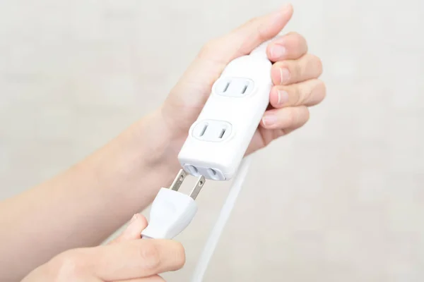 Woman Holding Electric Plug Extension Cord — Stock Photo, Image